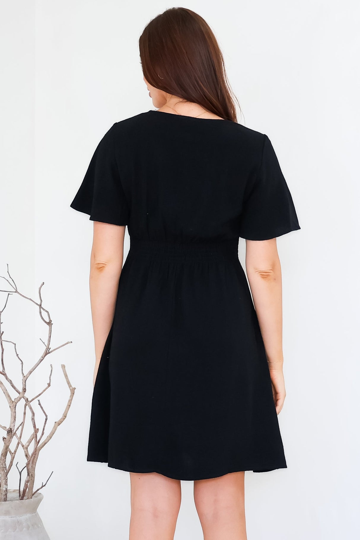 Stellar Mini Dress - Flutter Sleeve A-Line Dress with Pin Tuck Waist Detail in Black