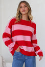 Model wearing a pink and red striped jumper called Sumner Jumper in Red from Salty Crush