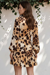 Model wearing Sybil Mini Dress in Leopard Print from Salty Crush