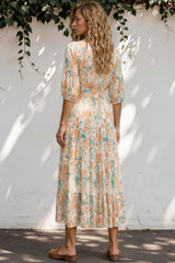 Model wearing Thianna Wrap Maxi Dress in Begonia Print from Salty Crush
