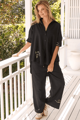 JAASE - Cici Pants: Mid Rise Relaxed Wide Leg Pant in Love Is All Round Print - Black