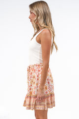 Walker Mini Skirt - High Waisted Elasticated Mini Skirt in Marigold Magic Print