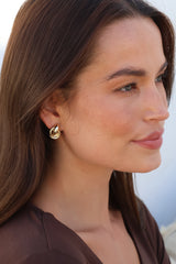Model wearing Zana Earrings in Gold from Salty Crush