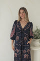 Thanya Midi Dress - V-Neck with Tie Balloon Sleeve Tiered Dress in Magah Print Navy