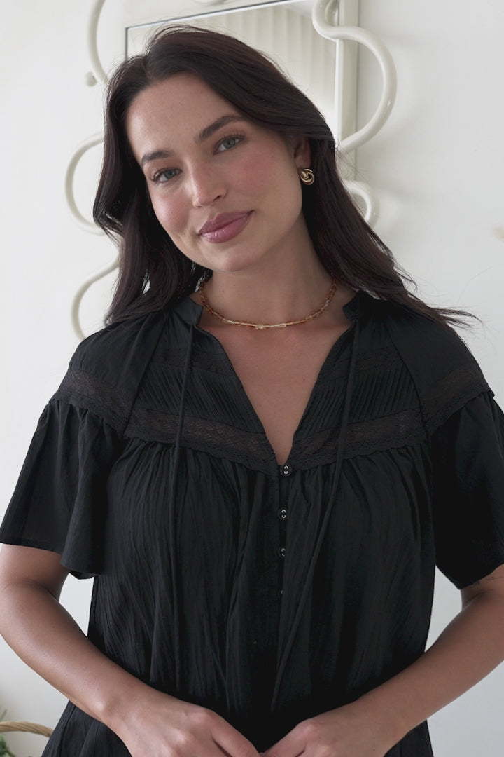 Model wearing Eveta Blouse in Black from Salty Crush