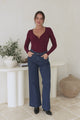 Roxana Top - Ribbed V Neck Long Sleeve Top with Gold Metal Accent in Wine
