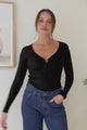 Roxana Top - Ribbed V Neck Long Sleeve Top with Gold Metal Accent in Black