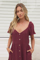 Model wearing Karina Midi Dress in Wine from Salty Crush