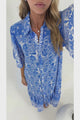 Addax Midi Dress - Collared Button Down Dress with Bell Sleeves and Ruffle Hem in Melina Print