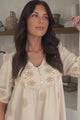 Patty Mini Dress - V-Neck Embroidered Babydoll Dress with 3/4 Sleeves in Solsana Print Beige