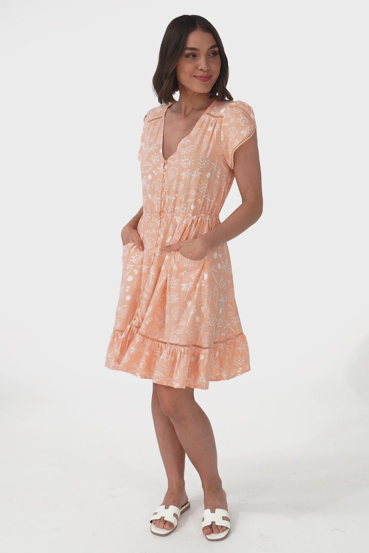 JAASE - Lizzie Mini Dress: Butterfly Cap Sleeve Button Down Dress with Pockets in Peach Island Print