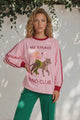 Woman models a Mermaid Vio Club pink long sleeve shirt from Salty Crush