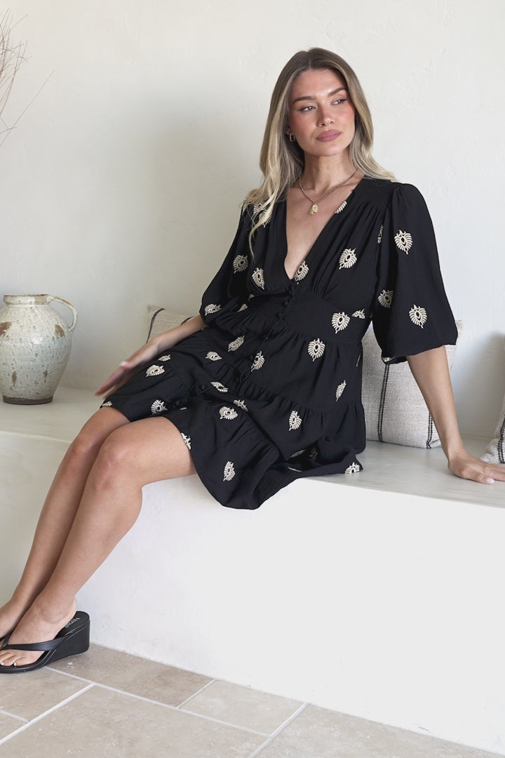 Model wearing Amilia Mini Dress in Ruiz Print Black from Salty Crush